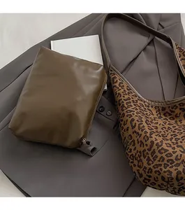 Leopard print tote bag detail showing the olive green removable inner pouch storage