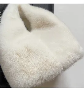 Close-up view of the soft white faux fur material on this stylish winter bucket bag