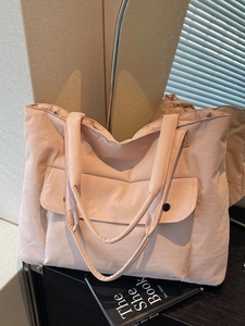 Pink large capacity canvas tote bag with front snap pocket and long shoulder straps