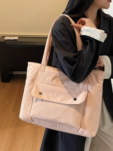 Pink large capacity canvas tote bag with wide strap and front flap pockets for women