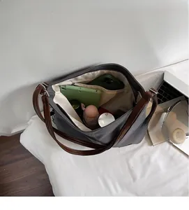 Top view of spacious grey canvas tote interior showing deep pocket and large capacity
