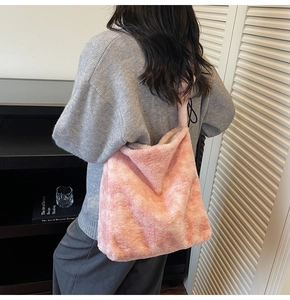 Pink plush tote bag detail showing fluffy texture and large capacity shoulder strap