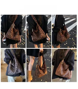 Detailed views of leopard print tote bag featuring wide shoulder strap and bead charm accessory