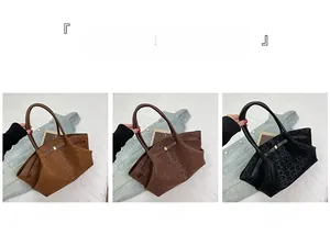 Detailed close-up showing the leopard print pattern on large suede tote bags in three colors