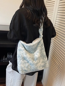 Chic light blue faux fur shoulder bag for women with a spacious and fluffy design