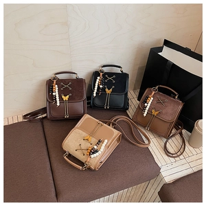 Collection of mini dual-use backpacks in four colors with bow metal clasp and tassels