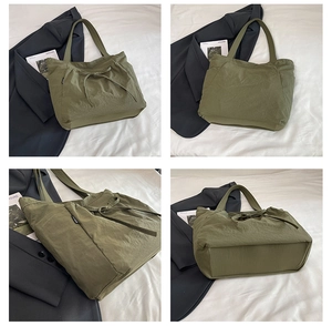 Detail view of army green canvas tote bag showing drawstring bow and side pockets