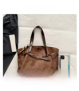 Brown faux suede tote bag with large capacity showing interior storage space for iPad