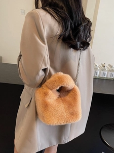 Brown faux fur bucket bag with silver chain strap for winter fashion accessories