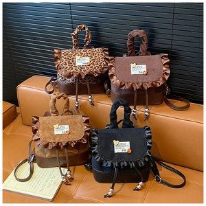 Mini leopard print and solid color drawstring backpacks with ruffled edge and bear patch