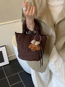 Vintage dark brown suede mini bucket bag with a cute plush puppy pendant and top handle