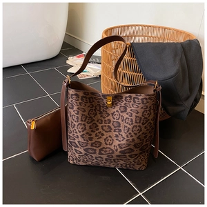 Detailed view of leopard print bucket bag set including a brown matching inner pouch