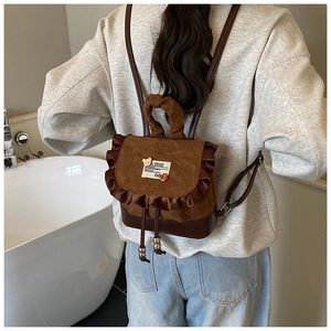 Rear view of mini leopard print backpack with ruffle detail and cute bear patch