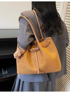 Large vintage brown suede tote bag for women shown as a stylish shoulder commute bag