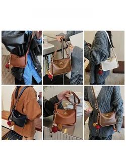 Detailed views of vintage PU leather saddle bags featuring metallic rotating clasps