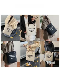 Vues détaillées du cabas en toile avec poignées en cuir en noir et beige