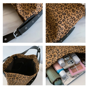 Detail of leopard print tote bag interior showing large capacity and magnetic snap closure