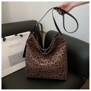 Detailed view of leopard print hobo bag with adjustable leather strap and spacious interior