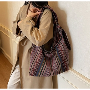 Detail of bohemian striped canvas tote bag showing textured weave and large capacity