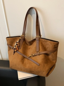 Vintage brown suede tote bag with dual straps and decorative beaded tassel charm