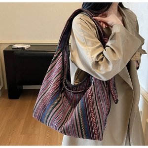 Detailed shot of large ethnic striped canvas tote bag with bohemian woven texture