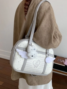 Star pattern shoulder bag with white angel wings and cute plush bear charm decoration