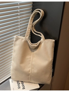 Minimalist beige corduroy tote bag for women with a vertical ribbed texture design