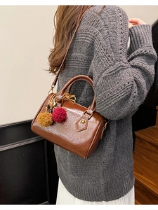 Vintage brown patent leather cylinder bag with colorful fur charms for women