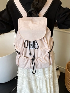 Minimalist light pink nylon backpack with drawstring flap closure for women