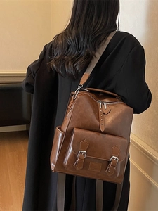 Vintage dark brown PU leather backpack for women with front buckle pockets and top handle