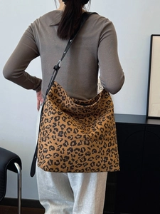 Large leopard print canvas tote bag for women with adjustable strap and spacious design