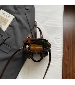 Internal view of the brown litchi pattern leather bag showing spacious storage capacity