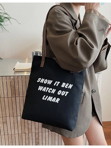 Grand sac fourre-tout minimaliste en toile noire avec lanières en cuir pour femme chic