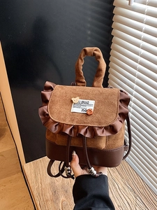 Vintage brown leopard style mini backpack with ruffles and plush bear accessory
