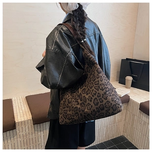 Detailed view of large brown leopard print tote bag with soft texture for daily use