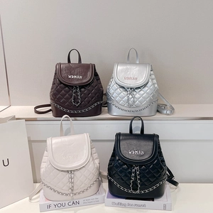 Close-up of quilted pattern and metal chain details on high-quality women's backpacks