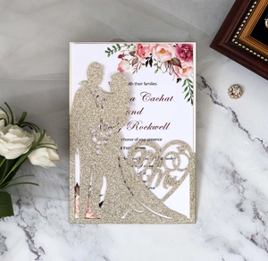 Laser cut wedding invitation featuring golden glitter silhouette and floral details