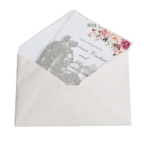 Silver glitter wedding silhouette topper featuring a couple and dog with a floral invite