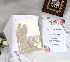 Laser-cut glitter wedding invitation with heart-shaped Mr & Mrs design and floral inner card