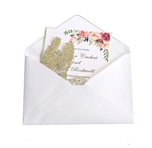 Elegant laser cut glitter gold wedding invitation set with floral card and white envelope