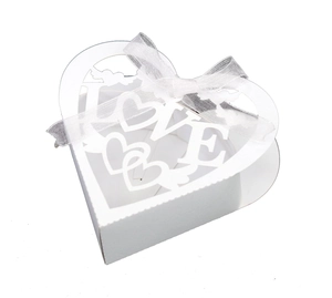 White heart-shaped laser cut wedding favor box with LOVE pattern and white ribbon bow