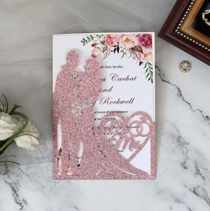 Detail of rose gold glitter laser-cut Mr & Mrs wedding invitation with floral insert