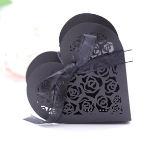 Elegant black heart-shaped laser-cut gift box with rose pattern and silk ribbon bow