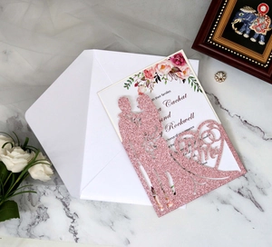 Pink laser cut wedding invitation with glitter heart Mr & Mrs silhouette and floral insert