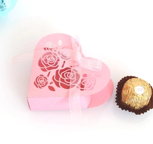 Pink heart-shaped gift box with laser-cut rose patterns and organza ribbon bow