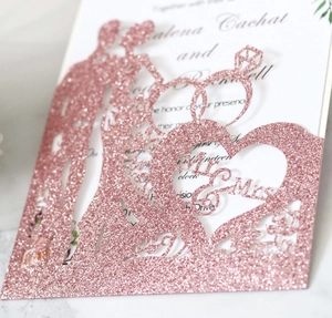 Detailed laser-cut rose gold glitter wedding invitation with Mr & Mrs silhouette pattern