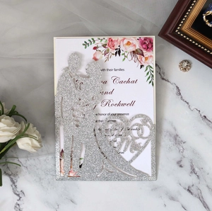 Detail of laser-cut glitter silver wedding invitation with Mr & Mrs floral insert