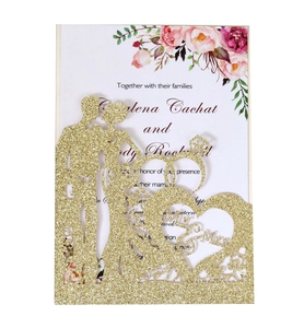 Laser-cut gold glitter wedding invitation with Mr & Mrs silhouette and floral inner card