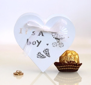 European heart-shaped party gift box for baby boys with It’s a boy print and white ribbon bow