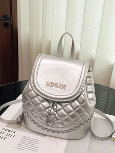 Silver quilted bucket backpack with metal chain trim and red WOMAN embroidery